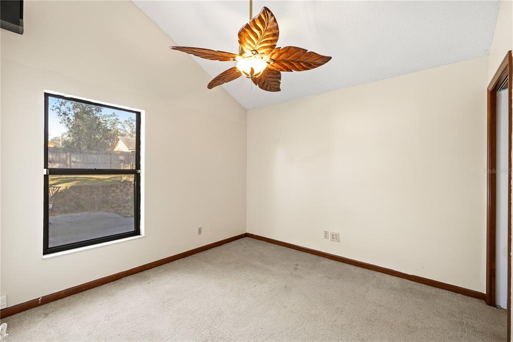 5444 Lighthouse Road Orlando, FL 32808 - Photo 13 of 36 a view of a small space with wooden floor and a chandelier