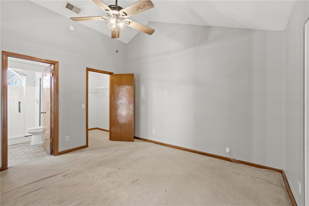 5444 Lighthouse Road Orlando, FL 32808 - Photo 20 of 36 an empty room with windows and fan