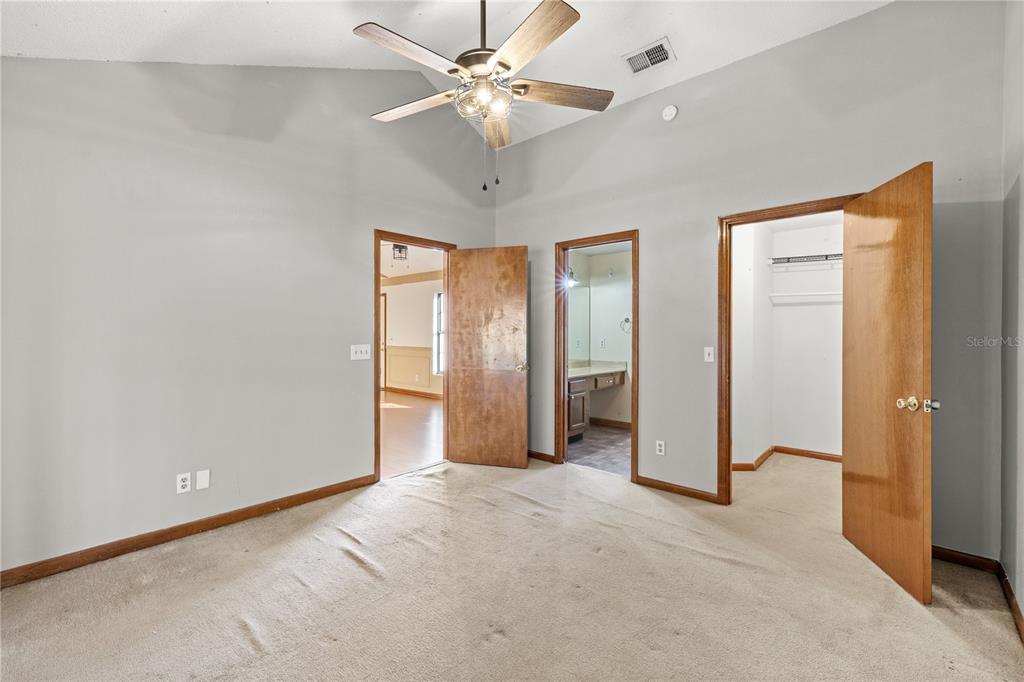 5444 Lighthouse Road Orlando, FL 32808 - Photo 21 of 36 a view of a room with an empty space and a ceiling fan