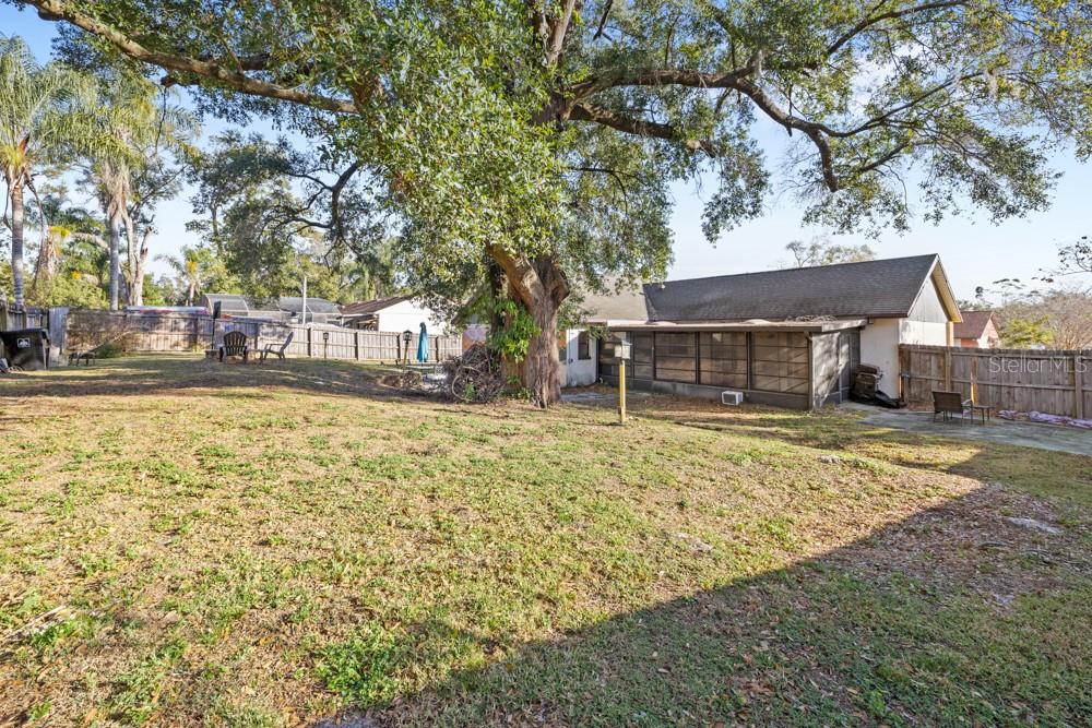 5444 Lighthouse Road Orlando, FL 32808 - Photo 29 of 36 a front view of a house with a yard