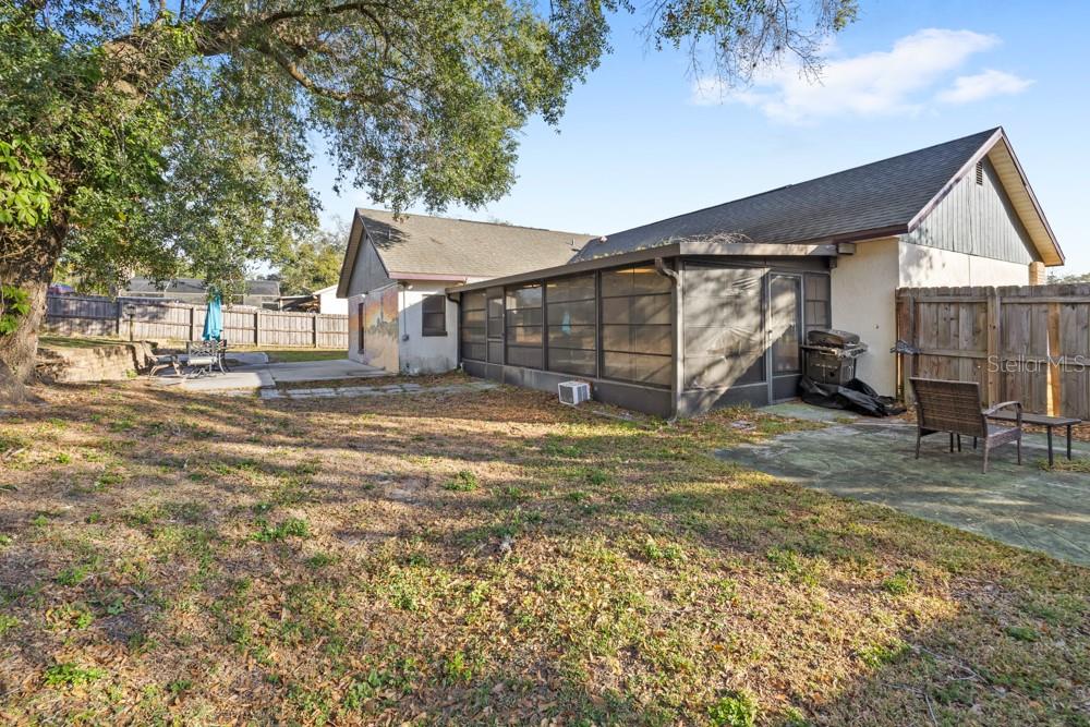 5444 Lighthouse Road Orlando, FL 32808 - Photo 30 of 36 a view of a house with a yard