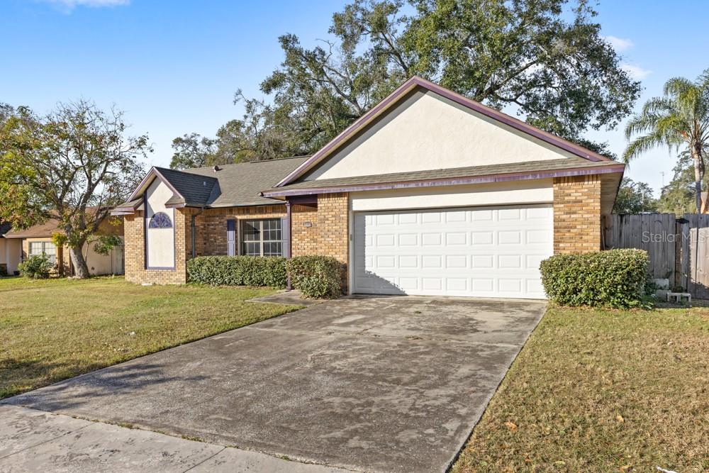 5444 Lighthouse Road Orlando, FL 32808 - Photo 3 of 36 a view of a house with a yard