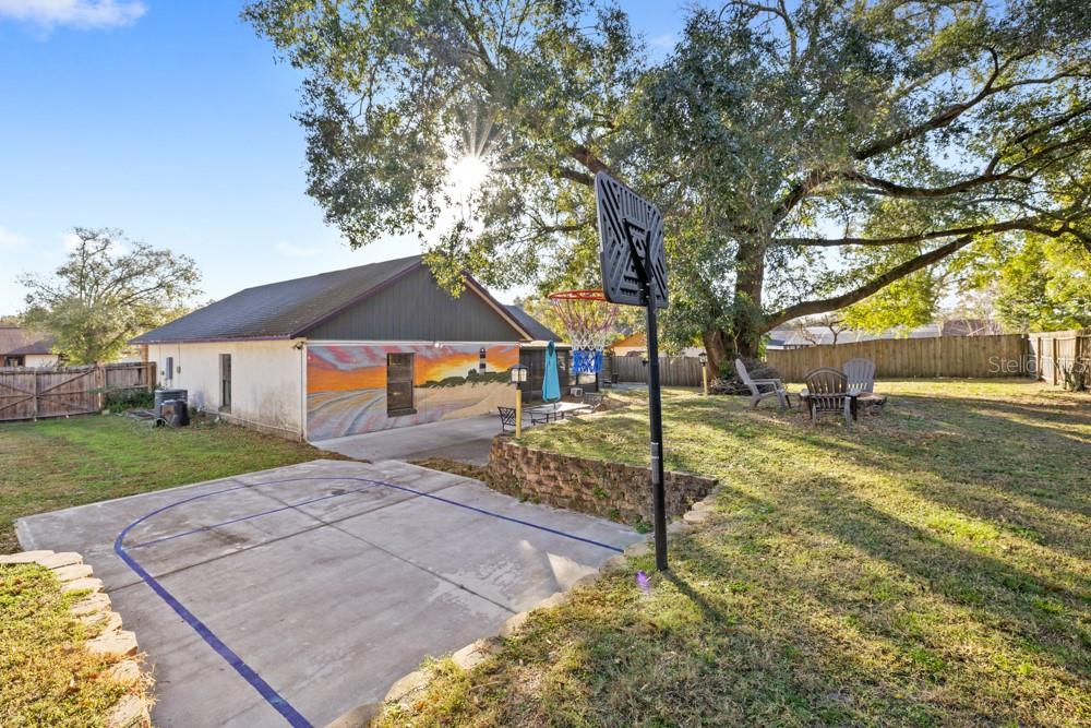 5444 Lighthouse Road Orlando, FL 32808 - Photo 32 of 36 a view of a house with a yard