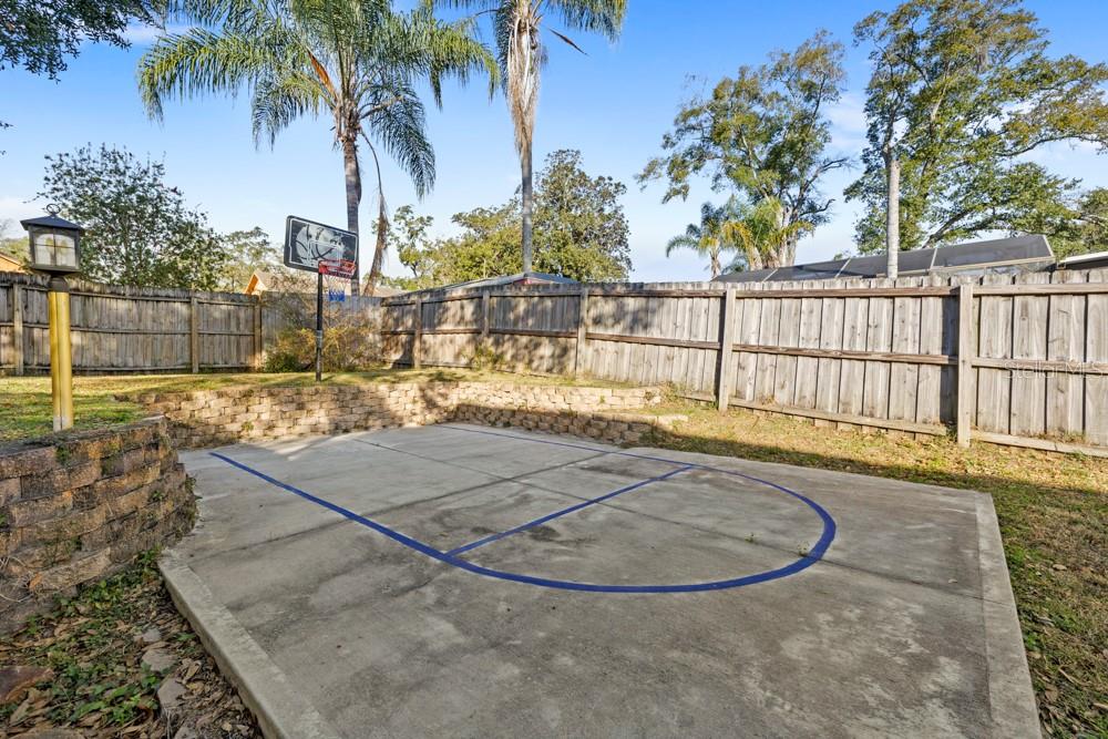 5444 Lighthouse Road Orlando, FL 32808 - Photo 34 of 36 a view of a swimming pool with a patio