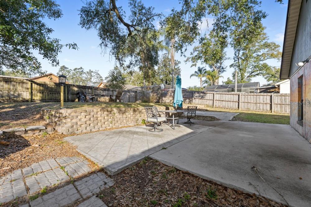 5444 Lighthouse Road Orlando, FL 32808 - Photo 35 of 36 a view of a backyard with large trees