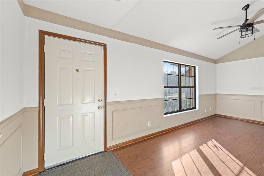 5444 Lighthouse Road Orlando, FL 32808 - Photo 4 of 36 an empty room with windows and closet