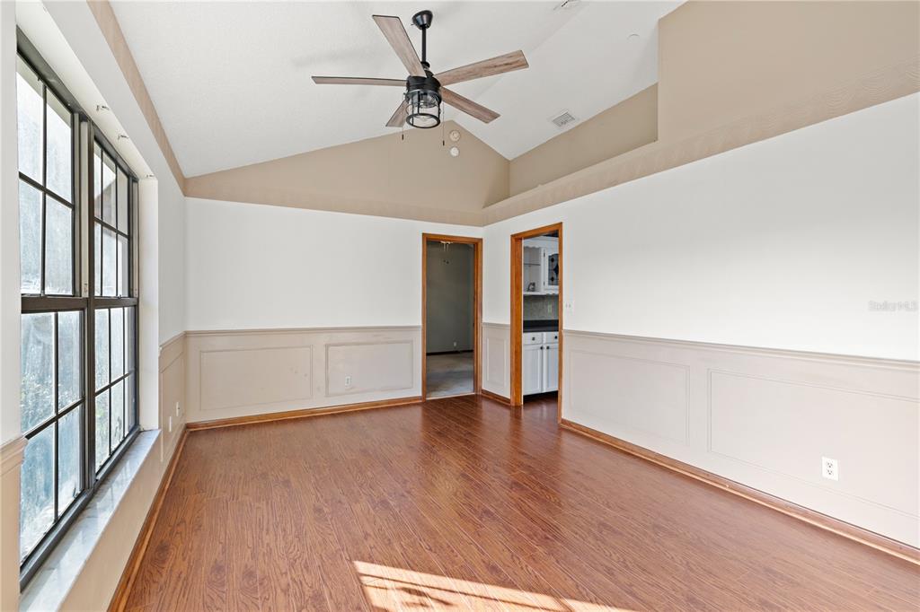5444 Lighthouse Road Orlando, FL 32808 - Photo 5 of 36 wooden floor in an empty room with a window
