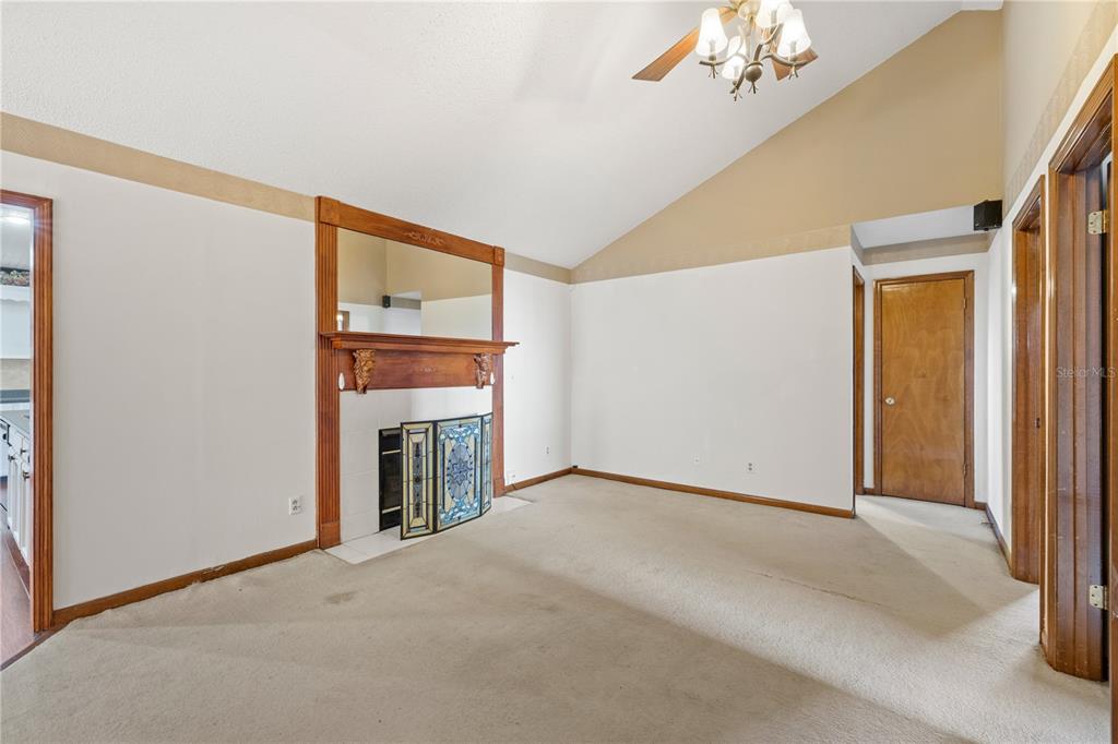 5444 Lighthouse Road Orlando, FL 32808 - Photo 8 of 36 a view of an empty room with a fireplace