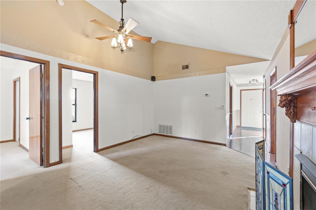5444 Lighthouse Road Orlando, FL 32808 - Photo 10 of 36 a view of a livingroom with a ceiling fan and window