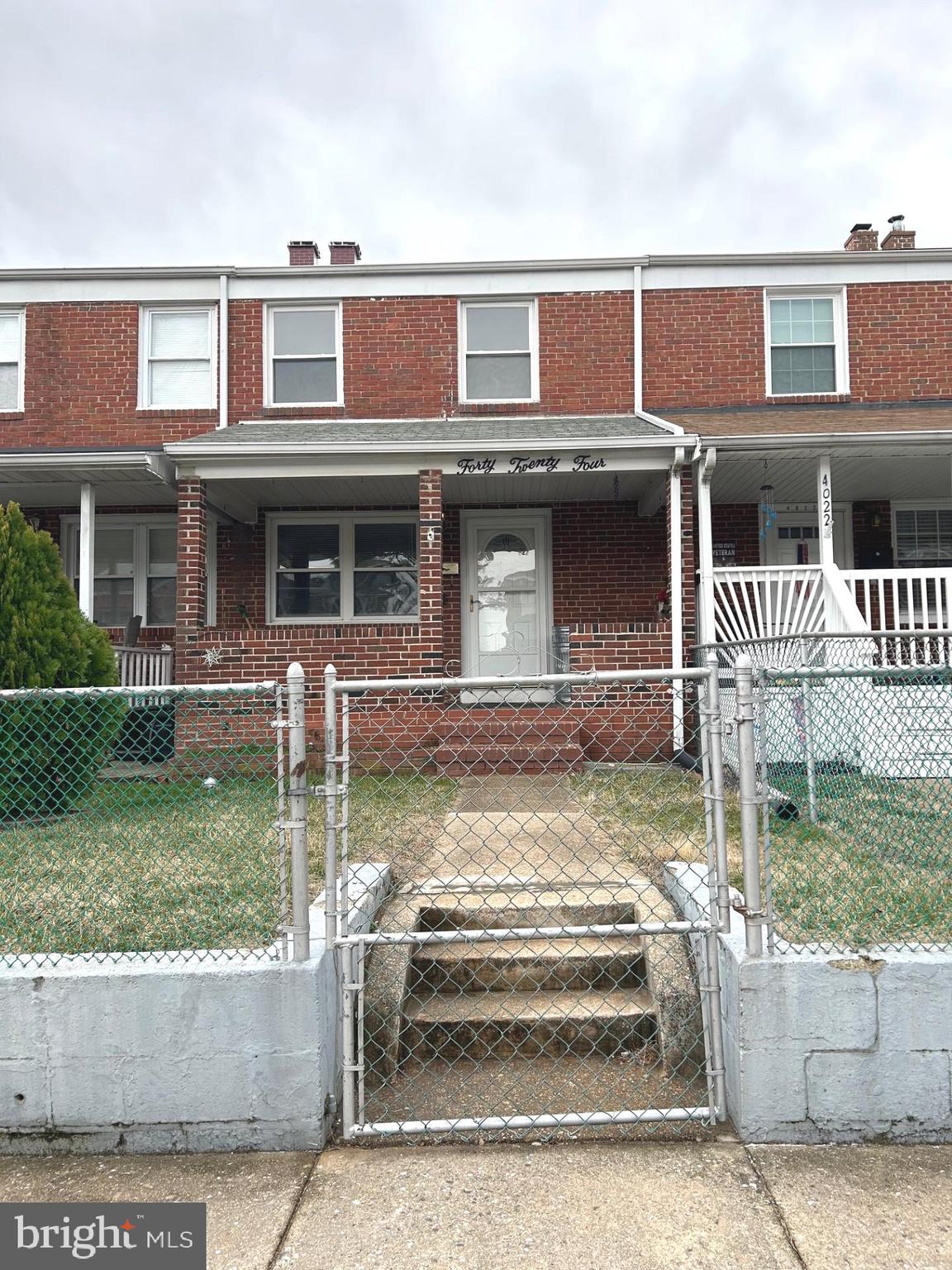 4024 St Augustine Lane Dundalk, MD 21222 - Photo 1 of 17 a front view of a house with garden