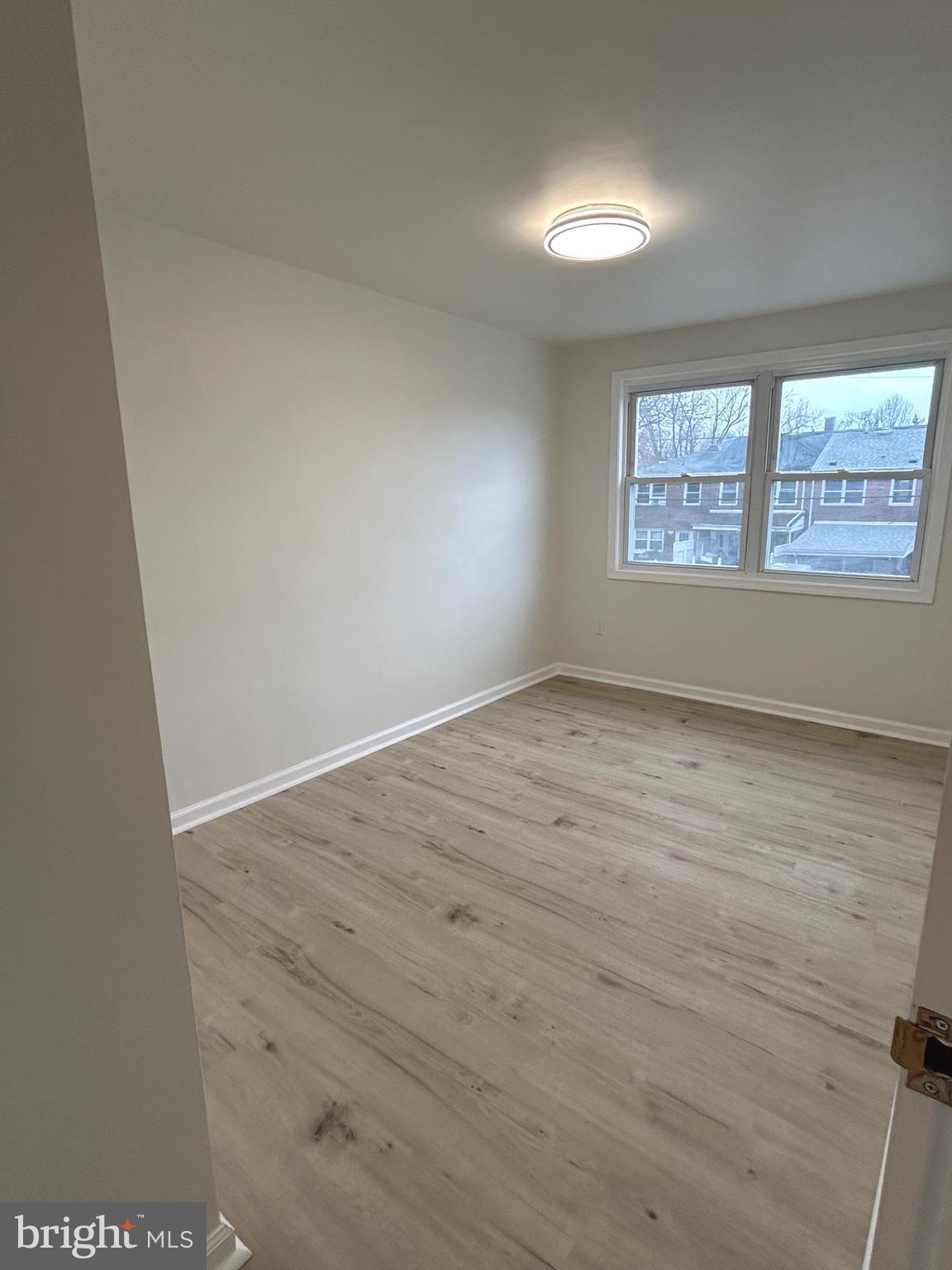 4024 St Augustine Lane Dundalk, MD 21222 - Photo 11 of 17 an empty room with a window