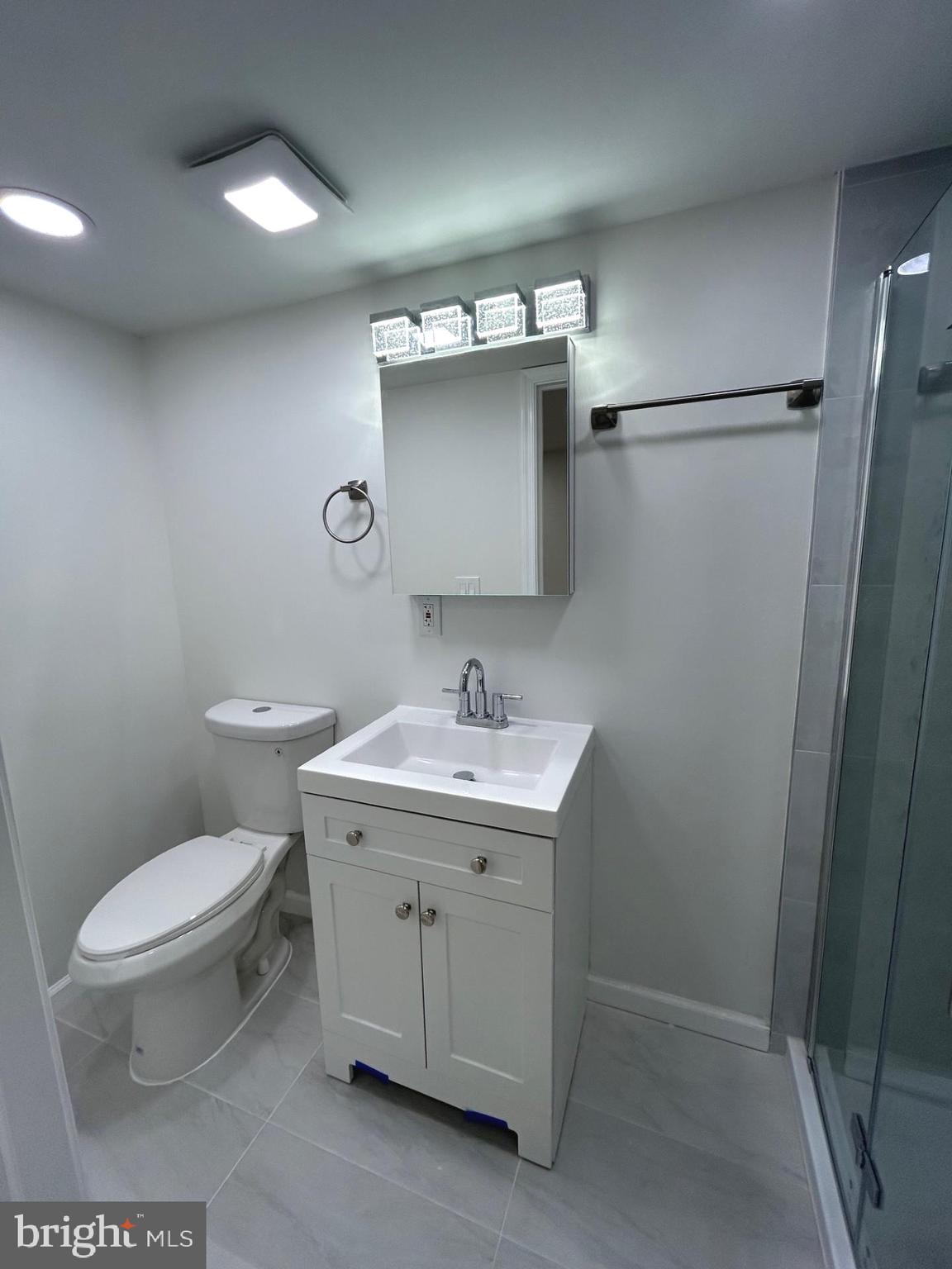 4024 St Augustine Lane Dundalk, MD 21222 - Photo 15 of 17 a bathroom with a toilet sink and mirror