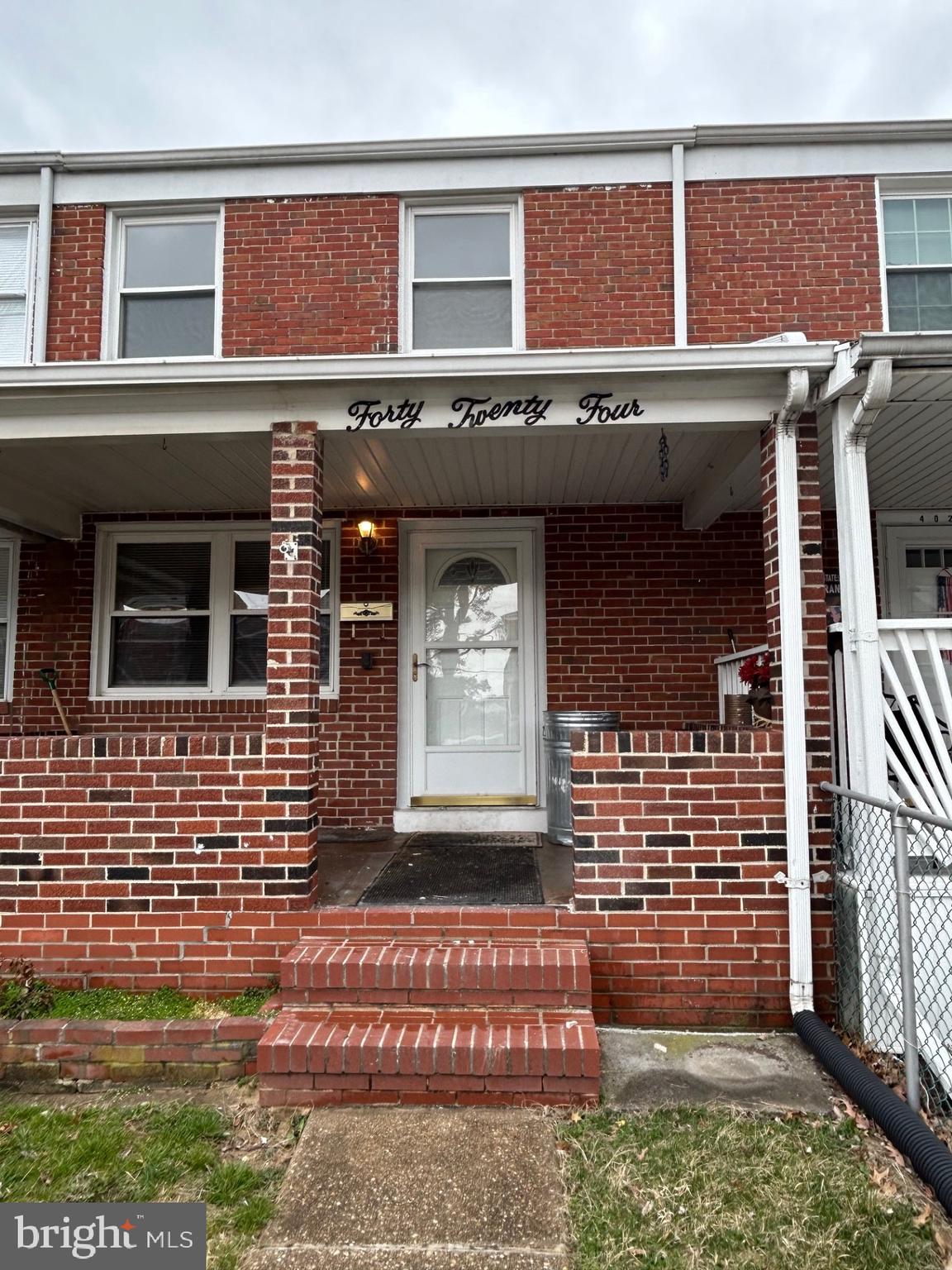 4024 St Augustine Lane Dundalk, MD 21222 - Photo 2 of 17 a front view of a house with a garden