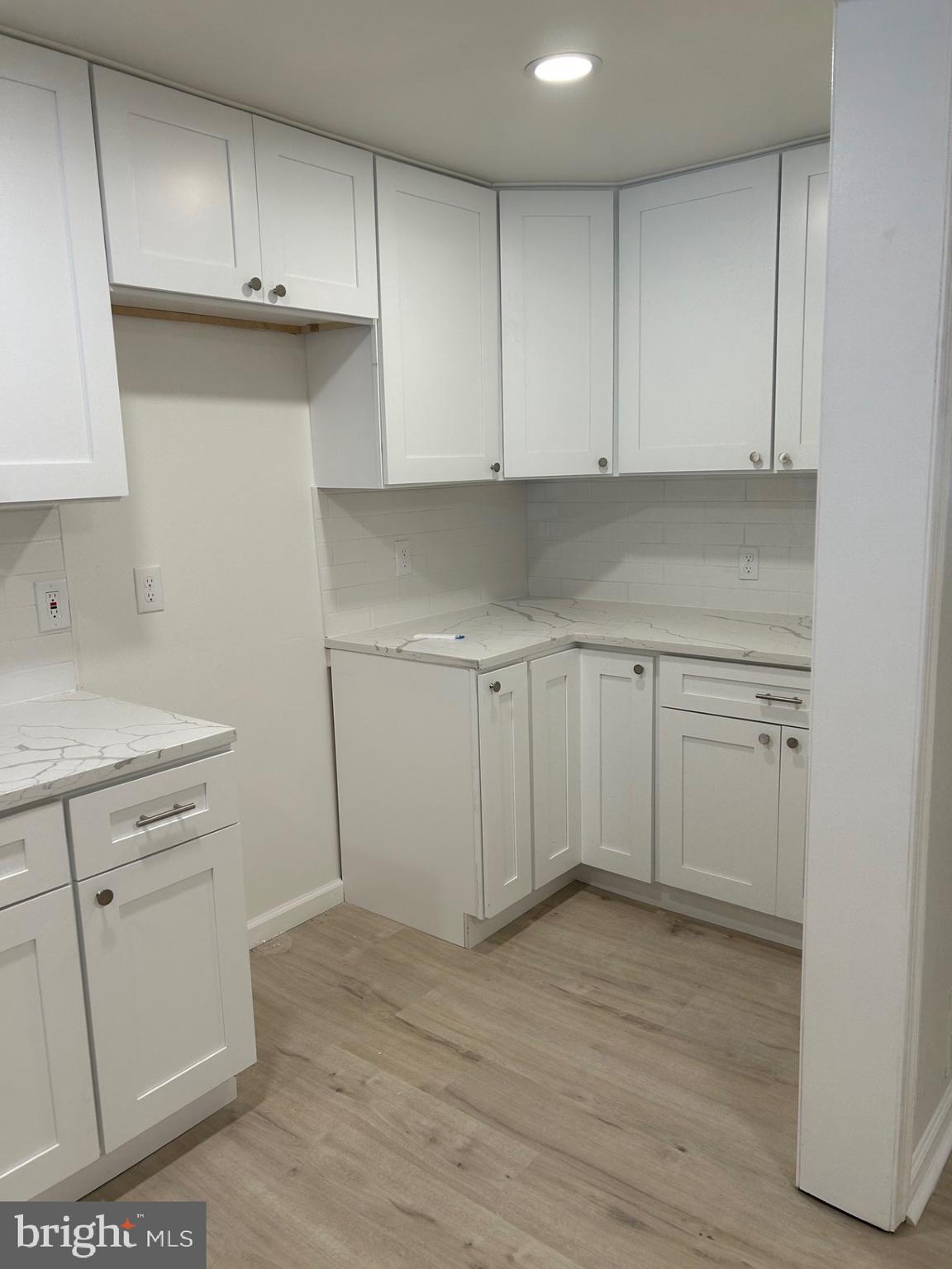 4024 St Augustine Lane Dundalk, MD 21222 - Photo 6 of 17 a view of a kitchen with wooden floor