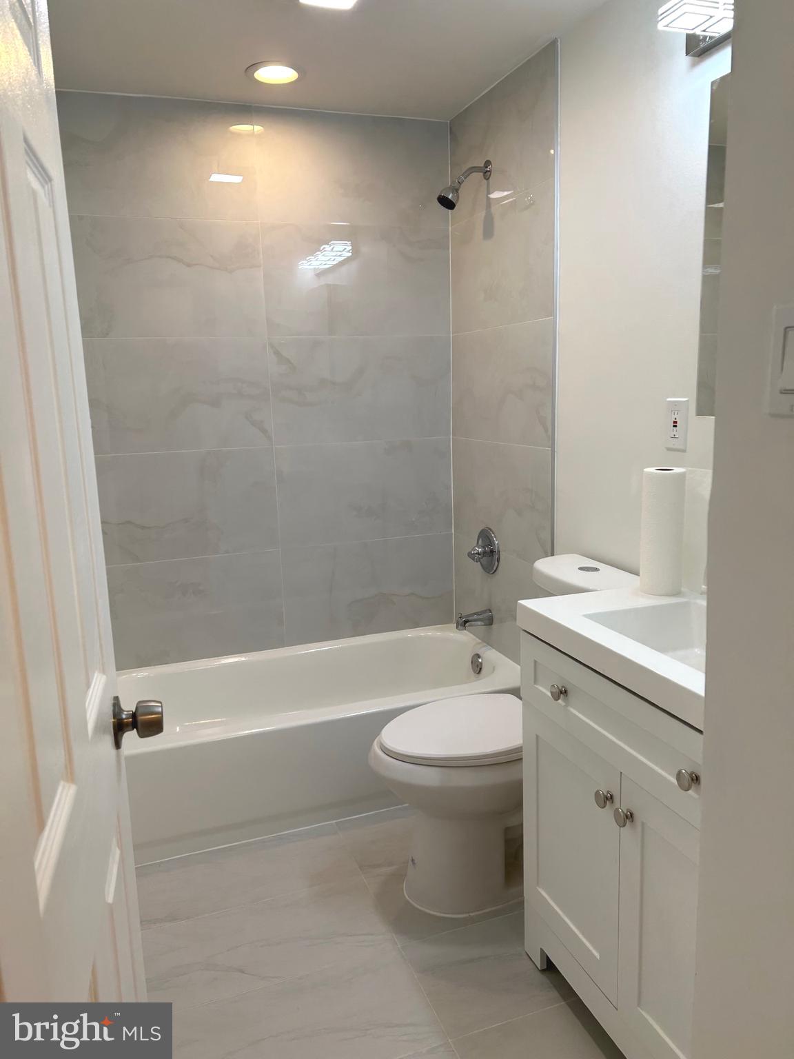 4024 St Augustine Lane Dundalk, MD 21222 - Photo 10 of 17 a bathroom with a sink a toilet and shower