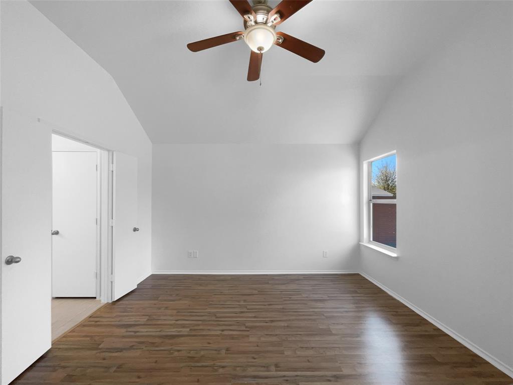104 Crown Drive Rhome, TX 76078 - Photo 3 of 20 a view of empty room with wooden floor and fan