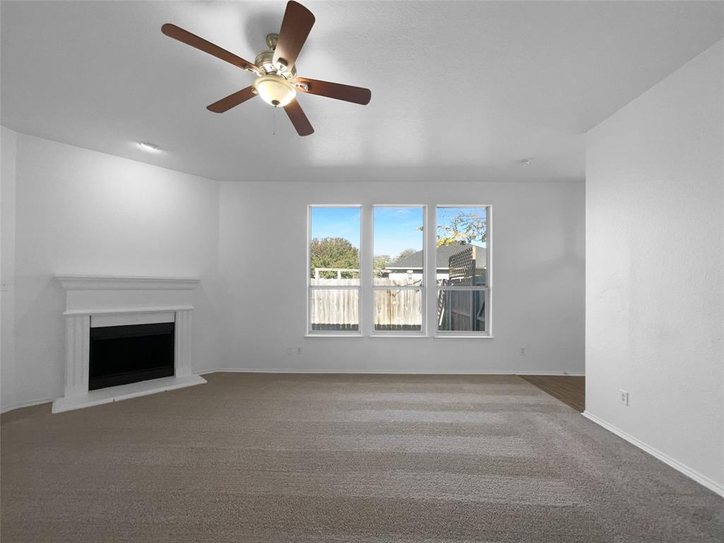 104 Crown Drive Rhome, TX 76078 - Photo 4 of 20 a view of an empty room with window fireplace