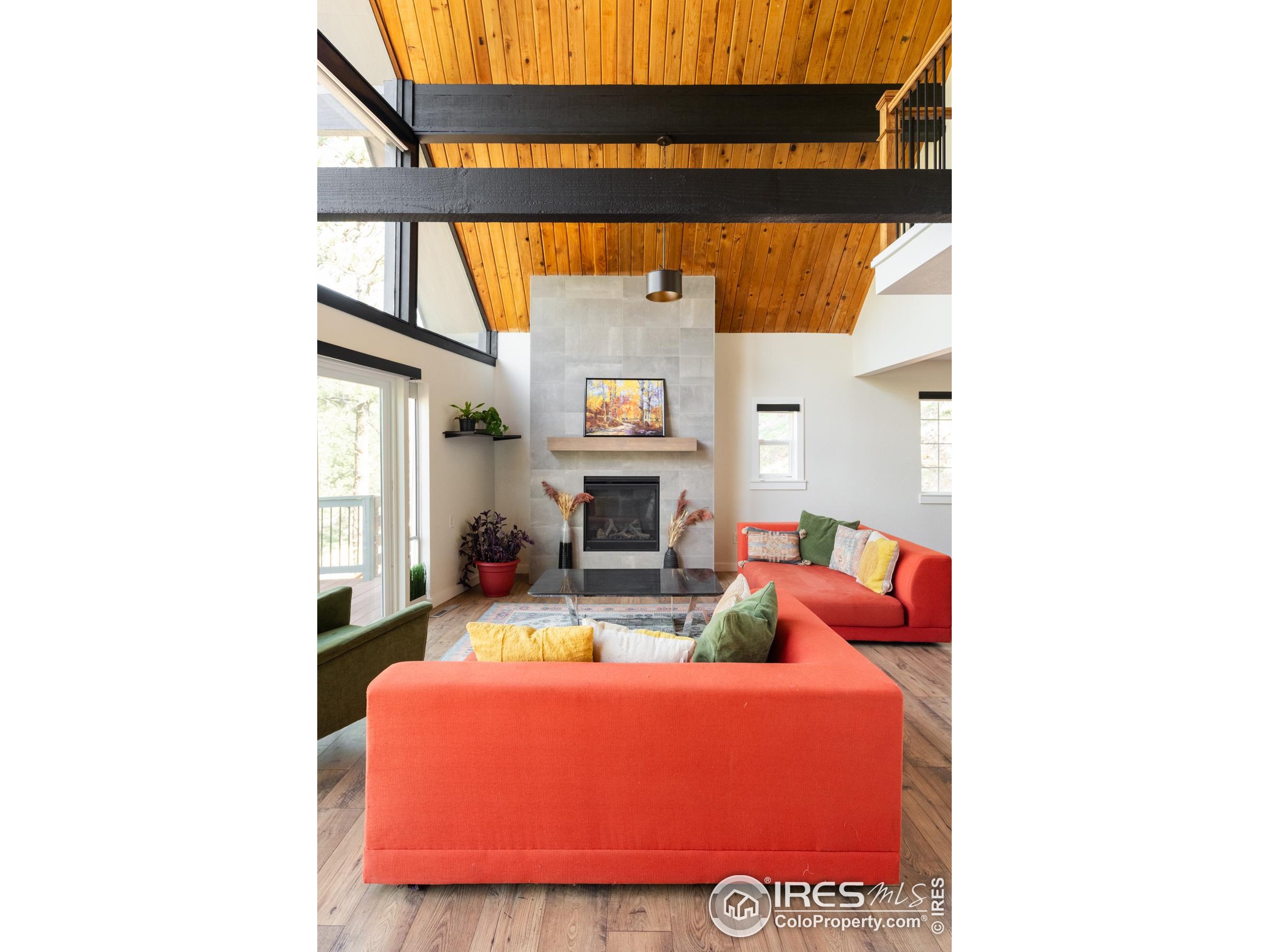 93 Pine Needle Road Boulder, CO 80304 - Photo 24 of 48 a living room with furniture and a fireplace