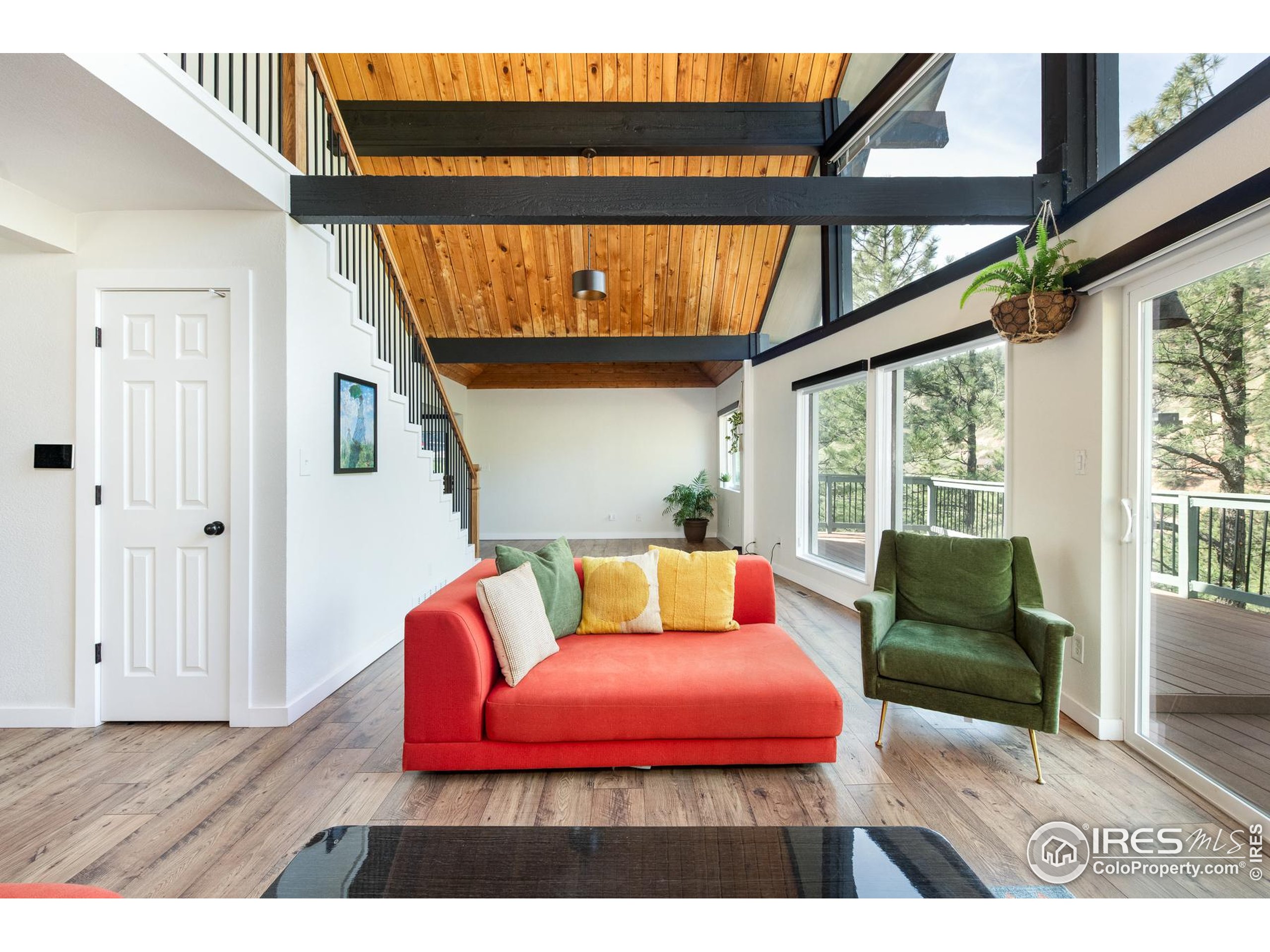 93 Pine Needle Road Boulder, CO 80304 - Photo 25 of 48 a bedroom with furniture and a large window