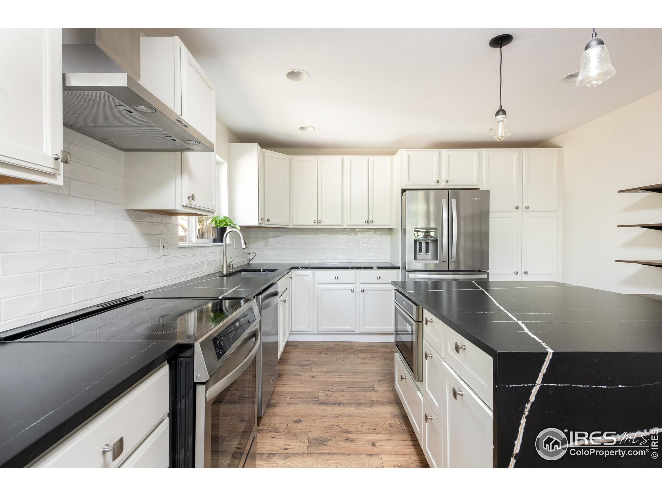 93 Pine Needle Road Boulder, CO 80304 - Photo 28 of 48 a kitchen with stainless steel appliances granite countertop a sink a stove and a refrigerator