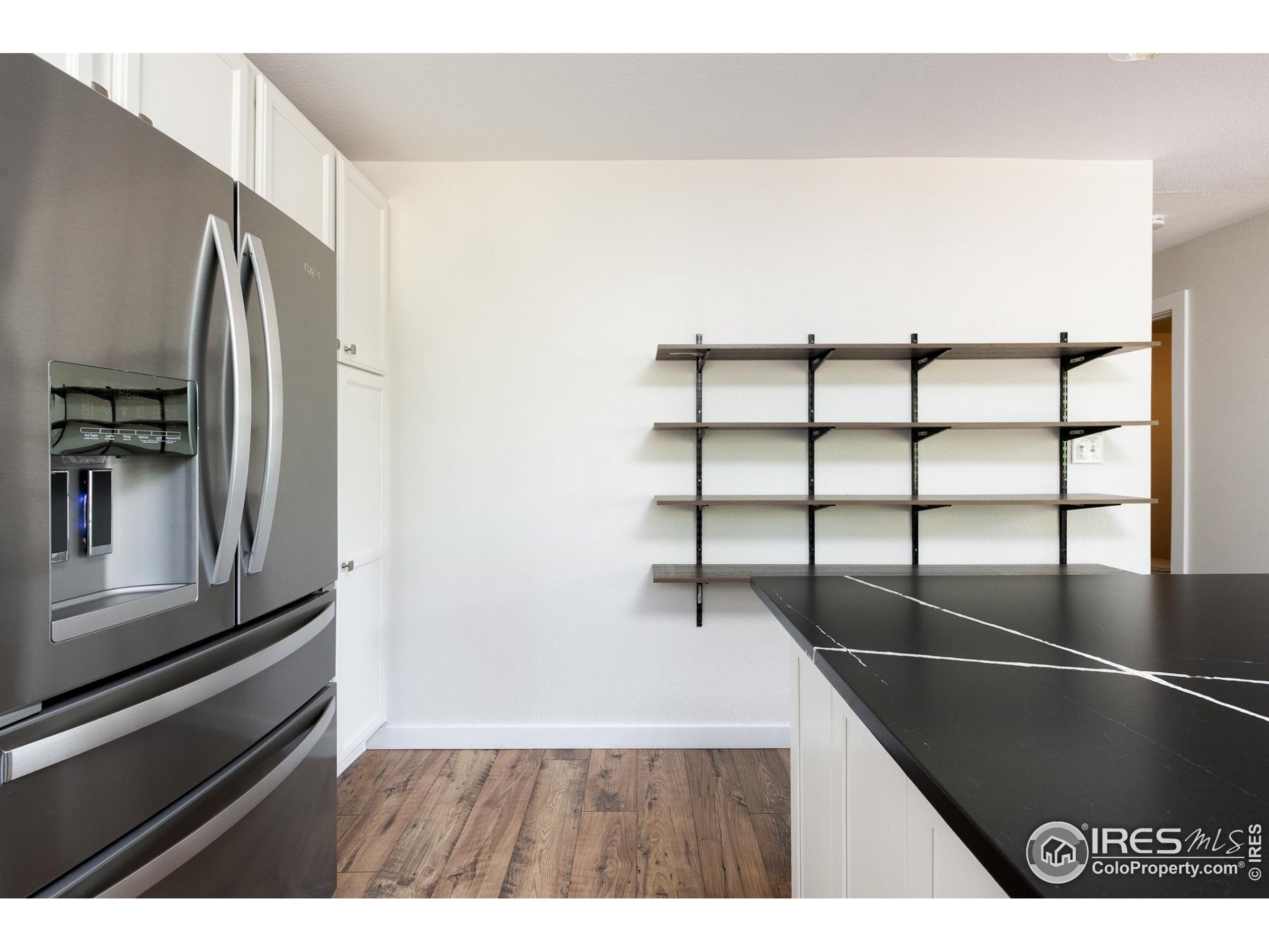 93 Pine Needle Road Boulder, CO 80304 - Photo 29 of 48 a view of a living room with a refrigerator and a window