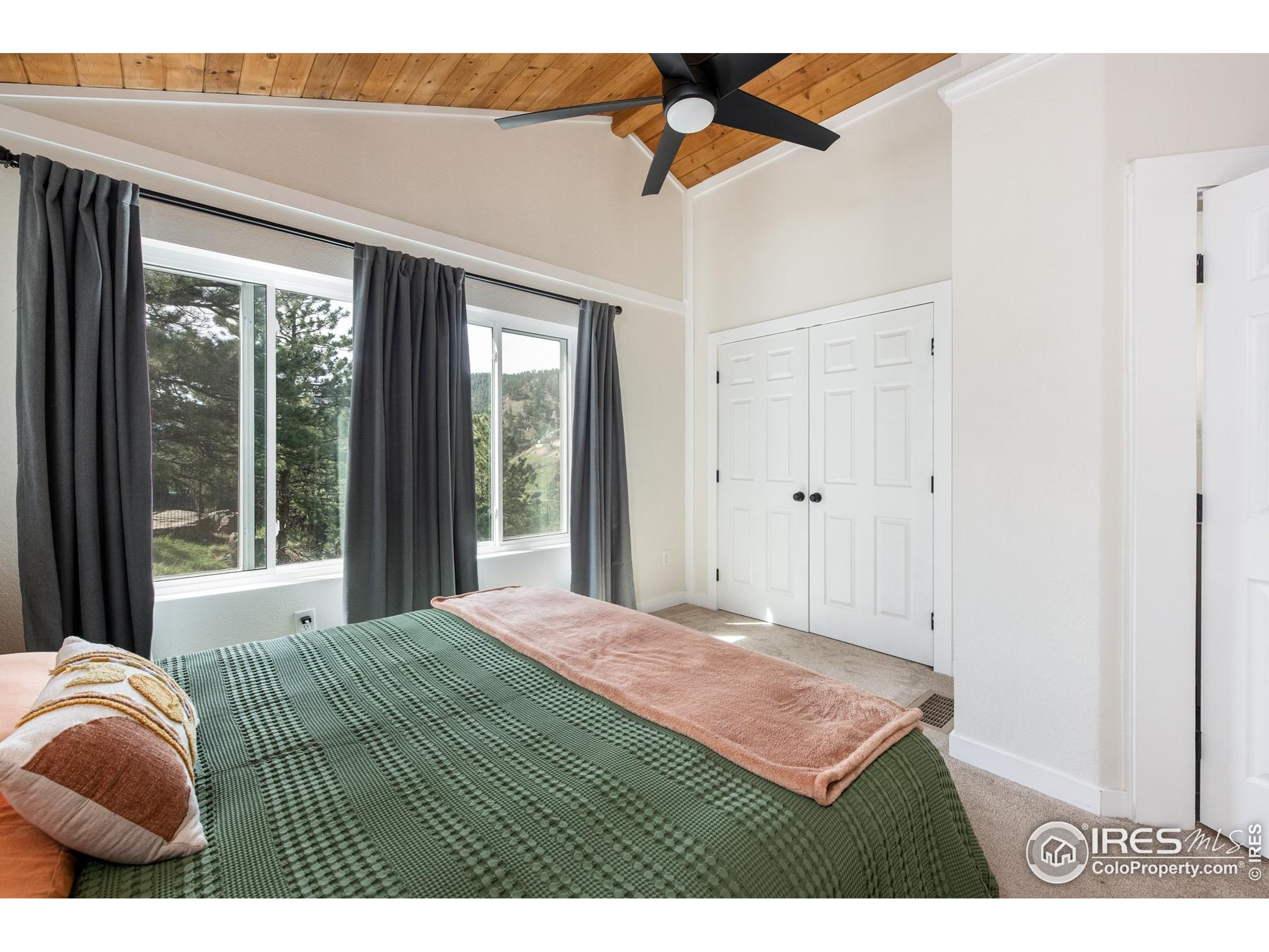 93 Pine Needle Road Boulder, CO 80304 - Photo 41 of 48 a bedroom with furniture and a window