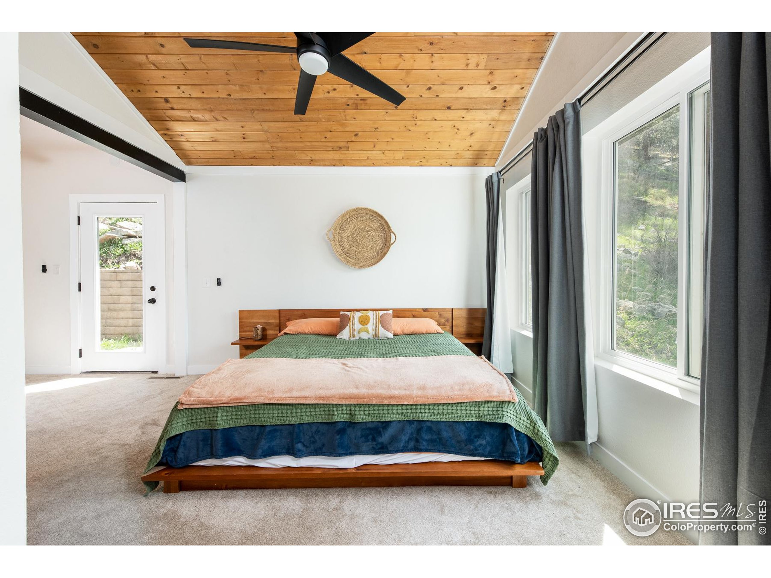 93 Pine Needle Road Boulder, CO 80304 - Photo 42 of 48 a bedroom with a bed and window