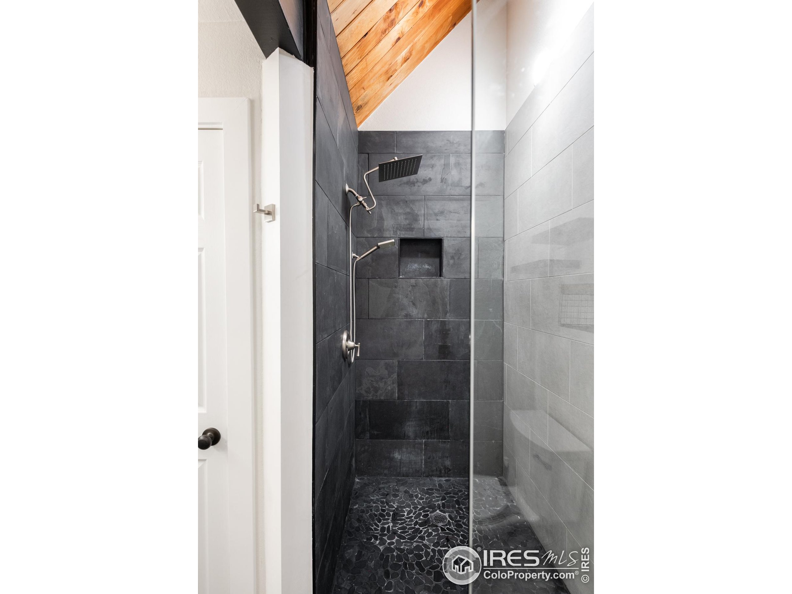 93 Pine Needle Road Boulder, CO 80304 - Photo 44 of 48 a bathroom with a glass shower door