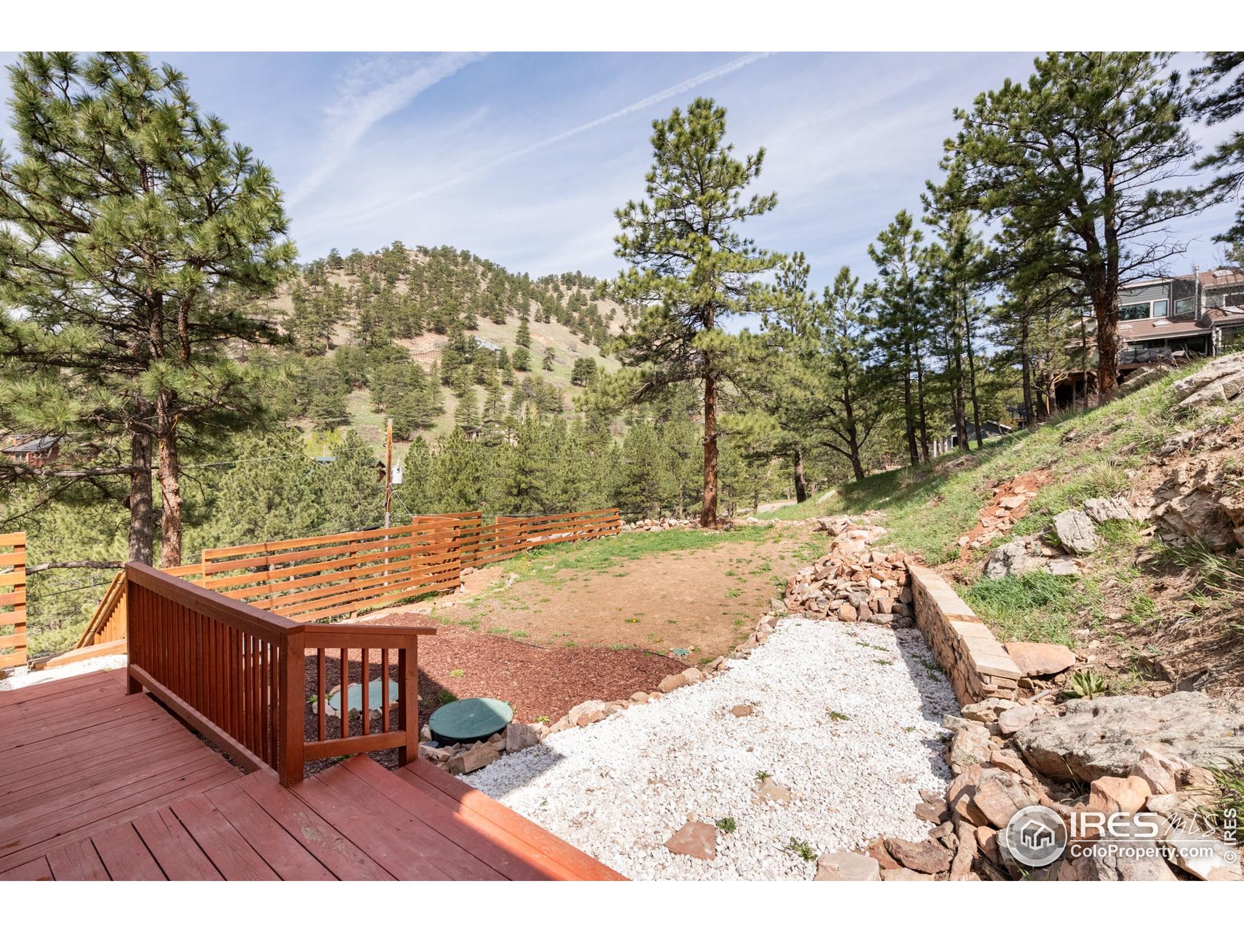 93 Pine Needle Road Boulder, CO 80304 - Photo 47 of 48 a view of a backyard with wooden fence