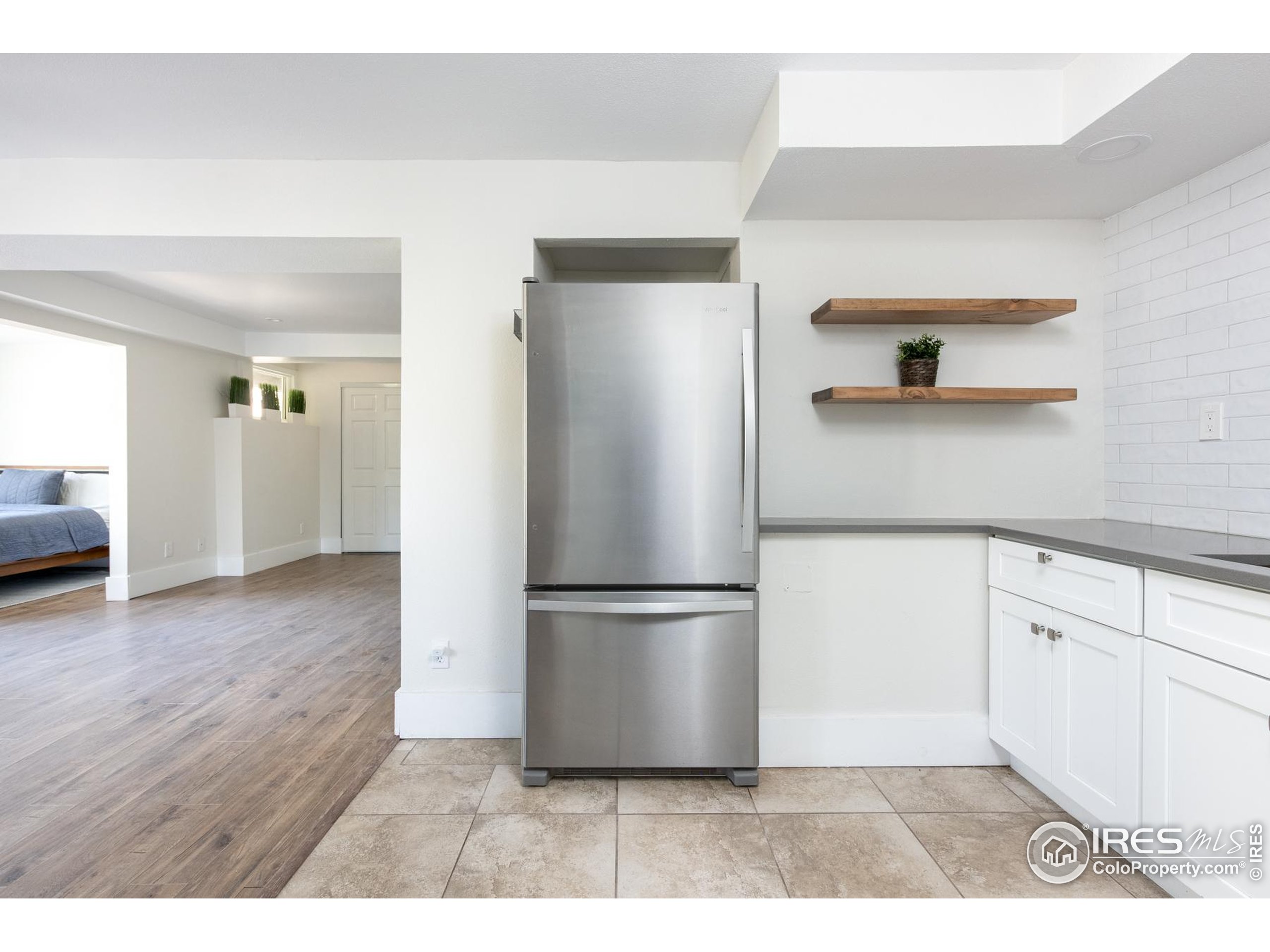 93 Pine Needle Road Boulder, CO 80304 - Photo 6 of 48 a kitchen with a refrigerator and a sink