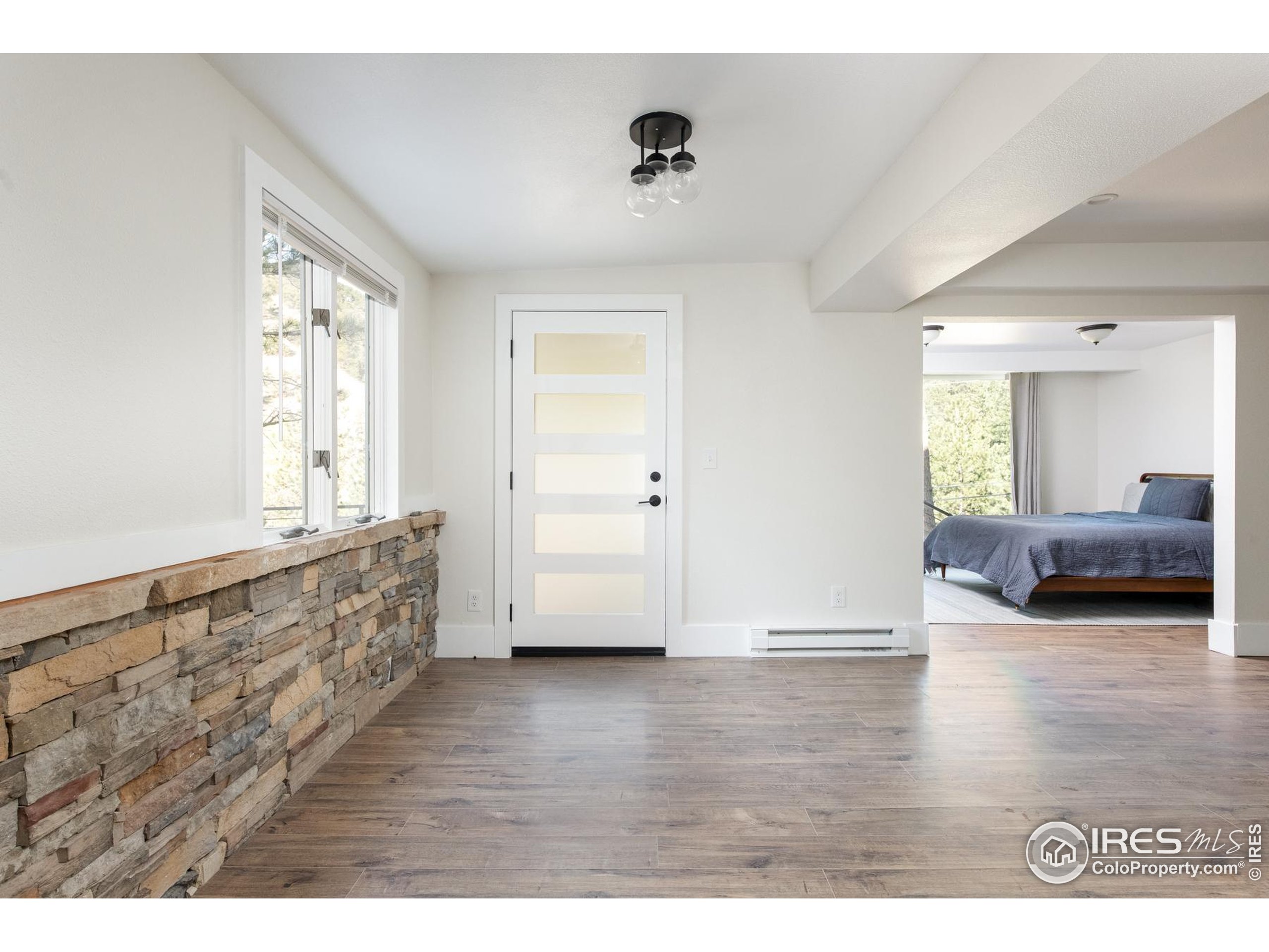 93 Pine Needle Road Boulder, CO 80304 - Photo 7 of 48 a view of livingroom with furniture and wooden floor