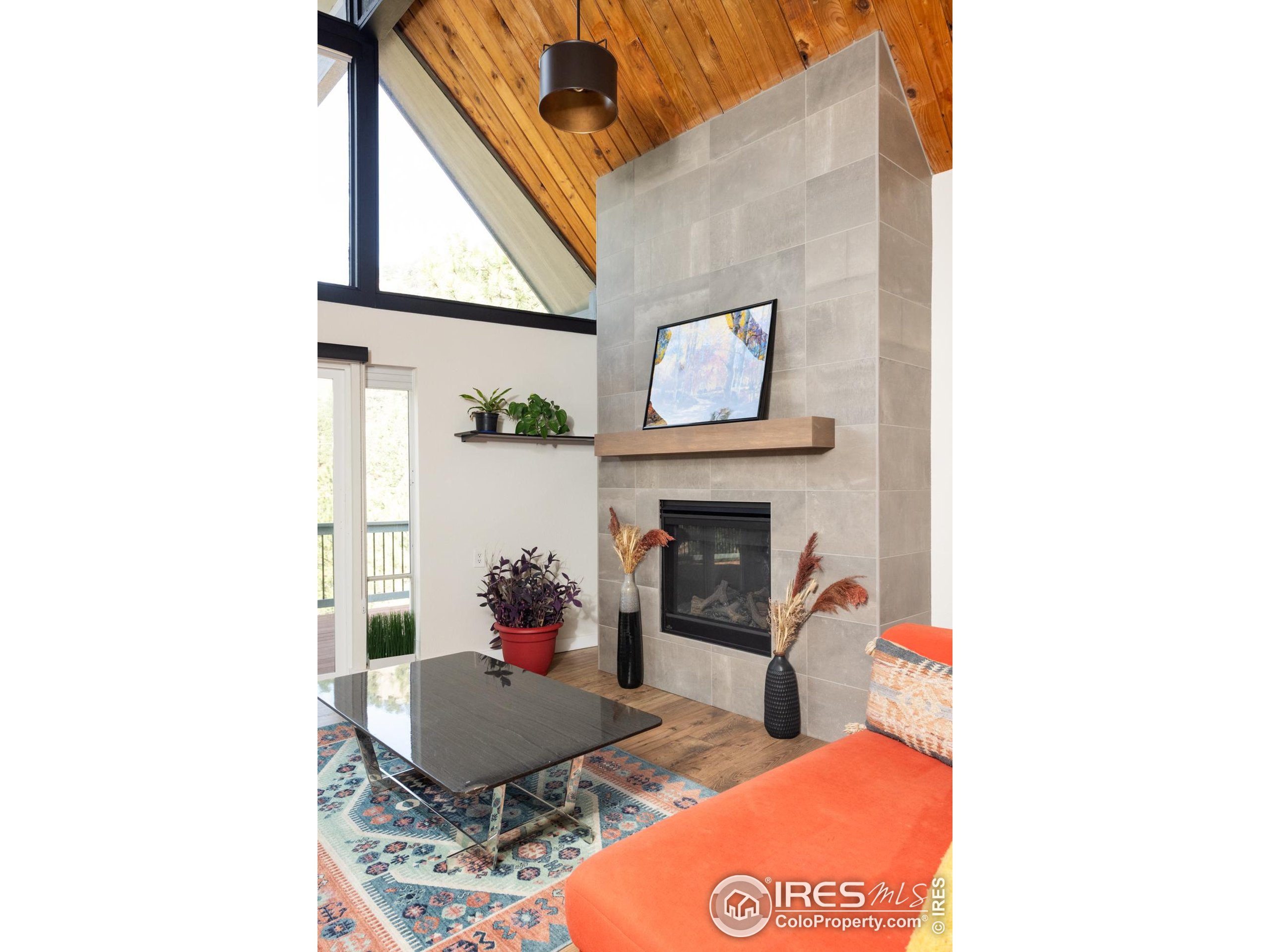 93 Pine Needle Road Boulder, CO 80304 - Photo 8 of 48 a living room with furniture and a fireplace