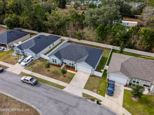 an aerial view of a house with swimming pool