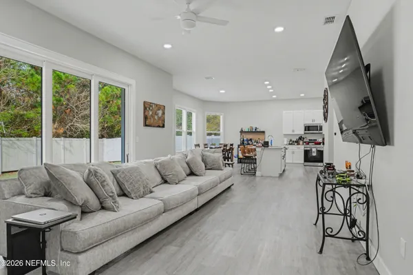 a living room with furniture and a flat screen tv