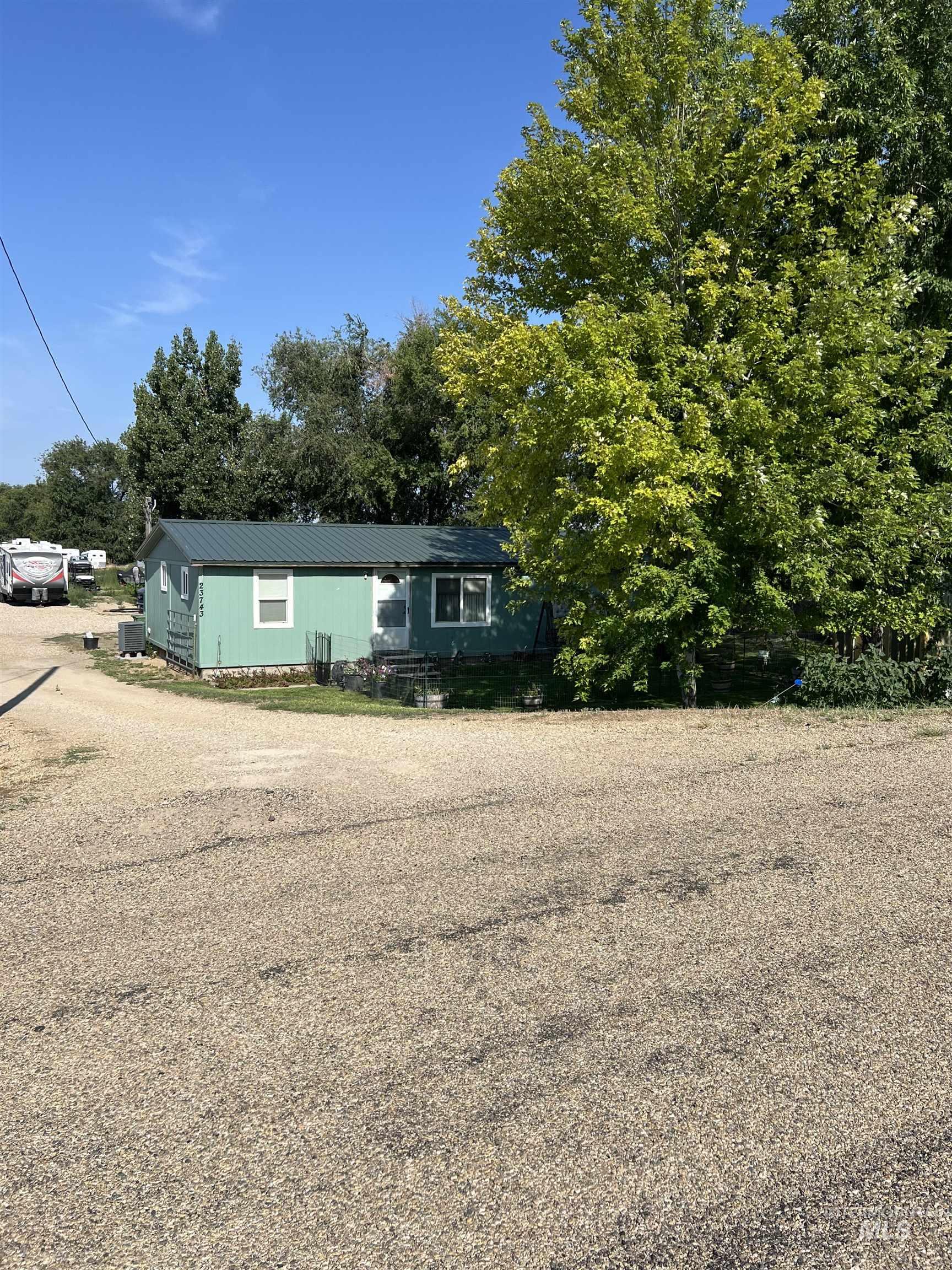 23743 Stephen Lane Parma, ID 83660 - Photo 22 of 34 Manufactured / mobile home featuring a metal roof and driveway