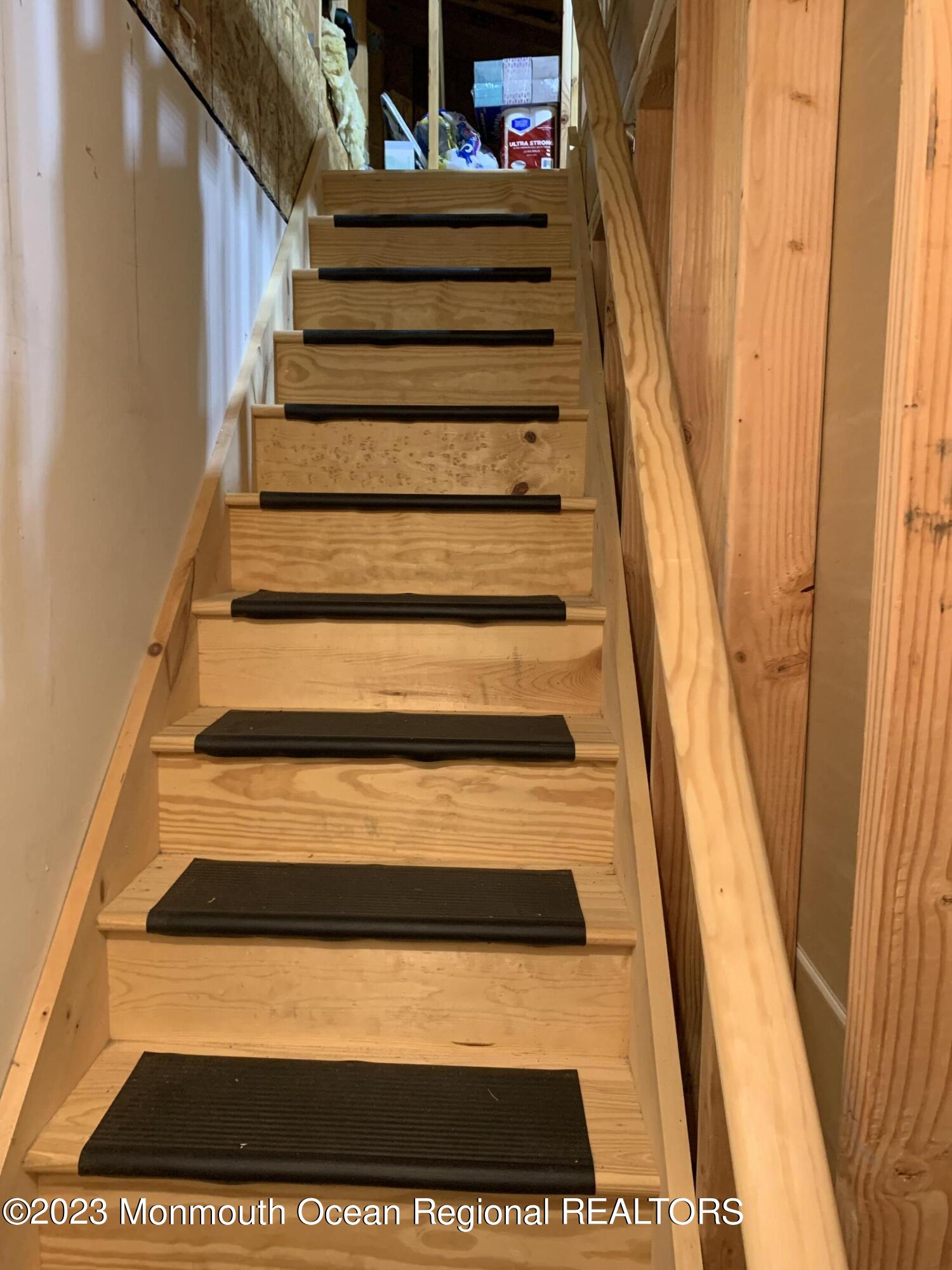 27 Carleton Drive Freehold, NJ 07728 - Photo 27 of 39 Above Garage Storage Stairs