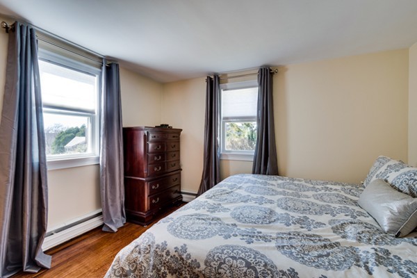 12 Grace Road Woburn, MA 01801 - Photo 8 of 18 a bedroom with a bed and a window