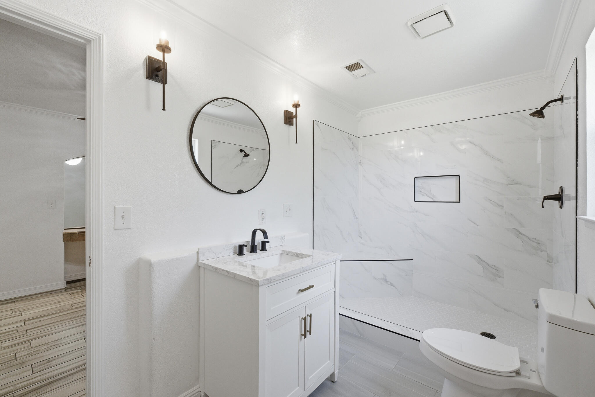 618 Birdsong Court Exeter, CA 93221 - Photo 35 of 62 a bathroom with a toilet a sink a mirror and shower