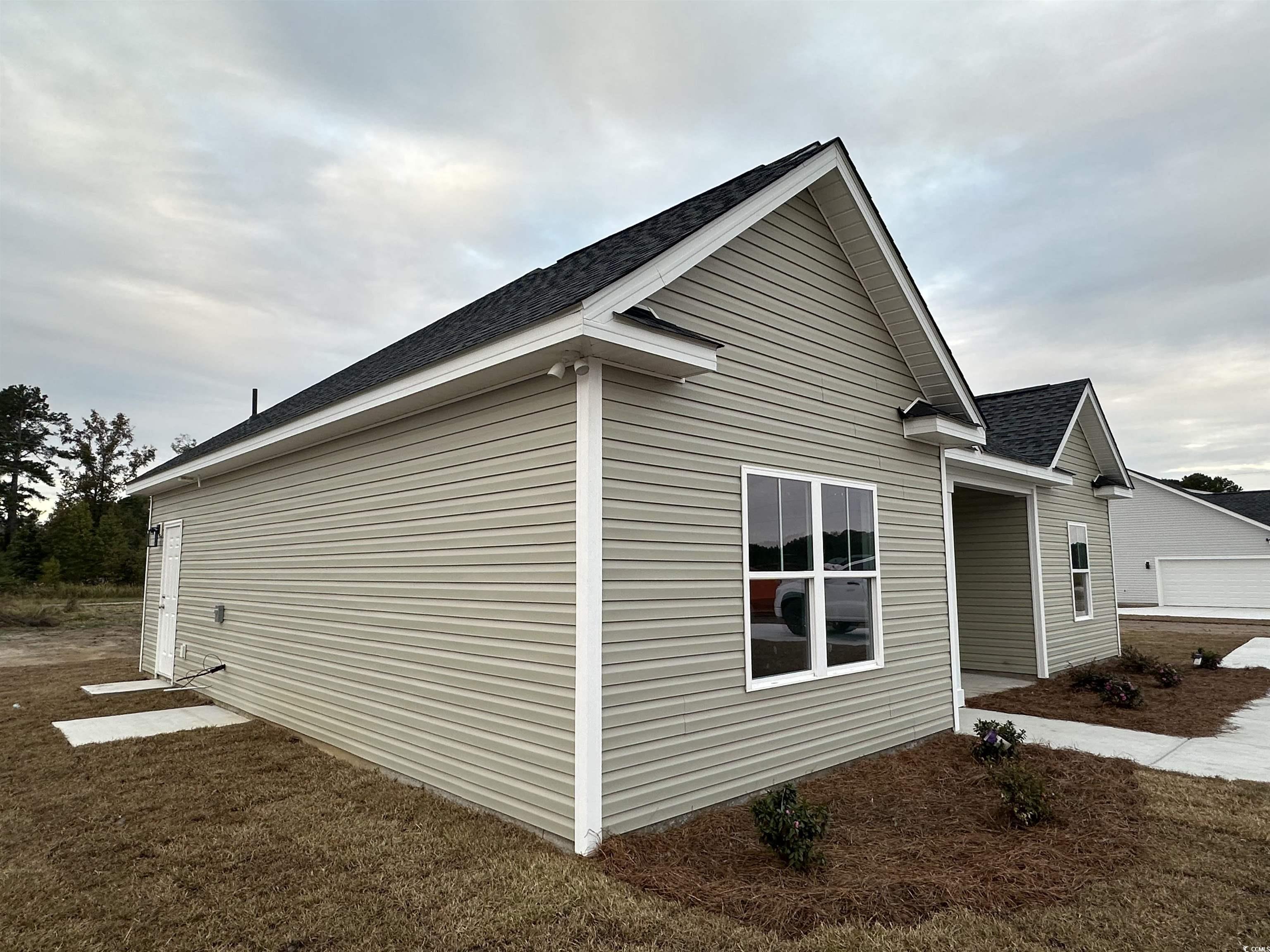3858 Red Bluff Road Loris, SC 29569 - Photo 2 of 29 View of side of home