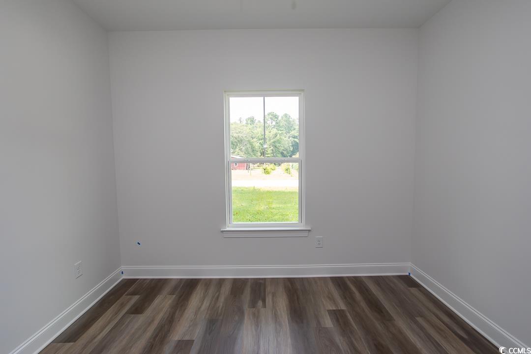 3858 Red Bluff Road Loris, SC 29569 - Photo 29 of 29 Spare room with dark hardwood / wood-style floors
