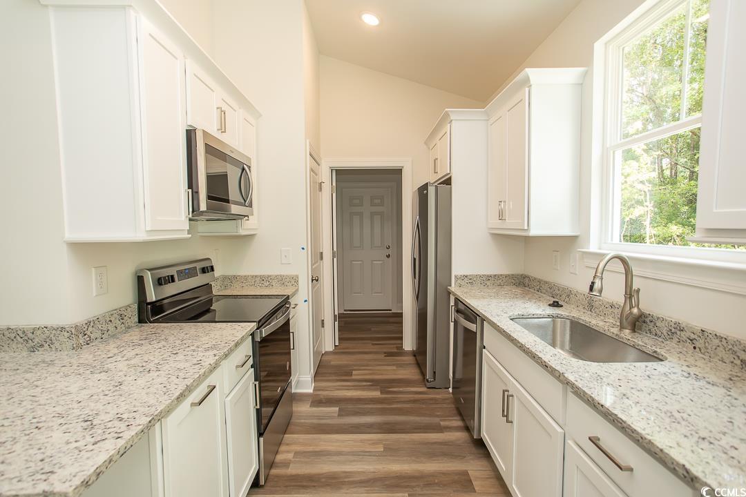 3858 Red Bluff Road Loris, SC 29569 - Photo 7 of 29 Kitchen with stainless steel appliances, dark hard