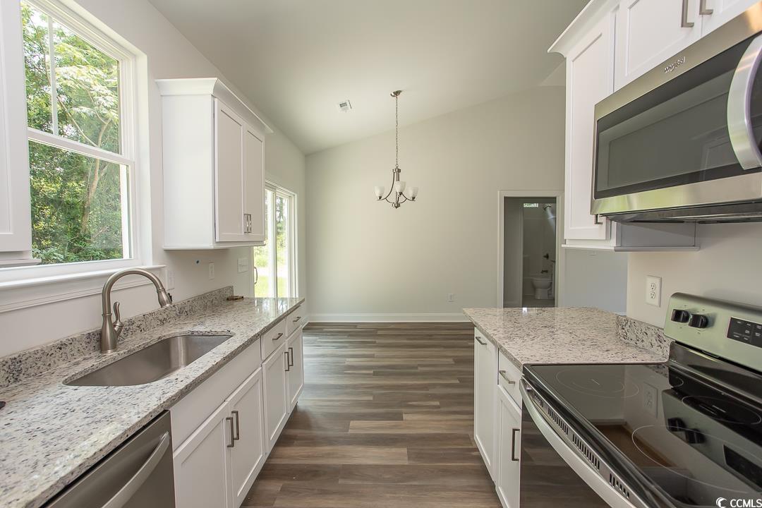 3858 Red Bluff Road Loris, SC 29569 - Photo 9 of 29 Kitchen featuring stainless steel appliances, a he