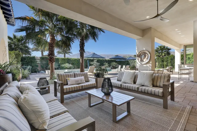 a view of a livingroom with wooden floor and windows