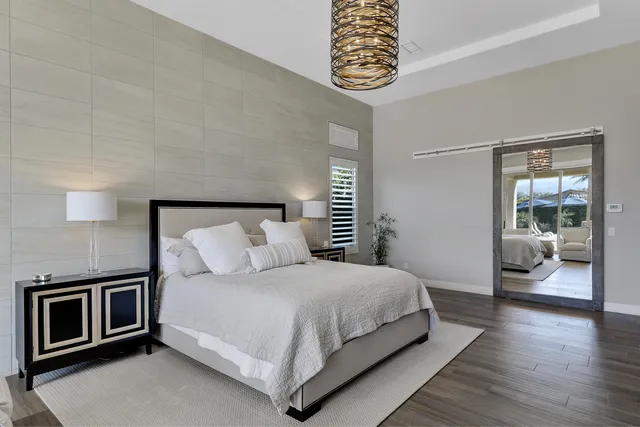 a spacious bathroom with a double vanity sink and a mirror