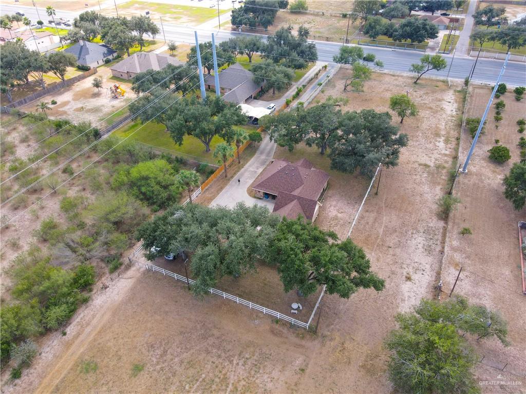 1401 East Mile 3 Road Palmhurst, TX 78573 - Photo 14 of 16 an aerial view of a house with a yard and lake view
