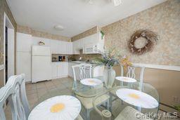 2710 South Road, Unit C8 Poughkeepsie, NY 12601 - Photo 8 of 22 Dining area with light tile patterned flooring