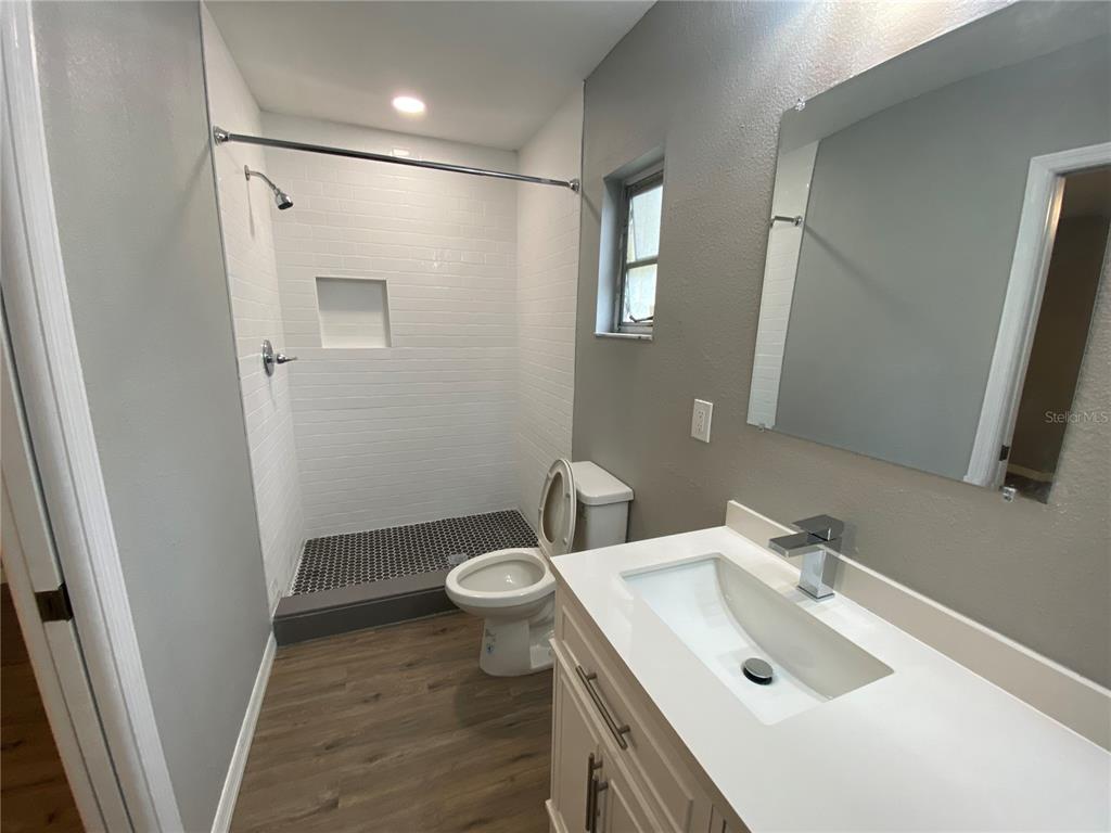 1908 West St Louis Street Tampa, FL 33607 - Photo 11 of 28 a bathroom with a sink toilet and shower