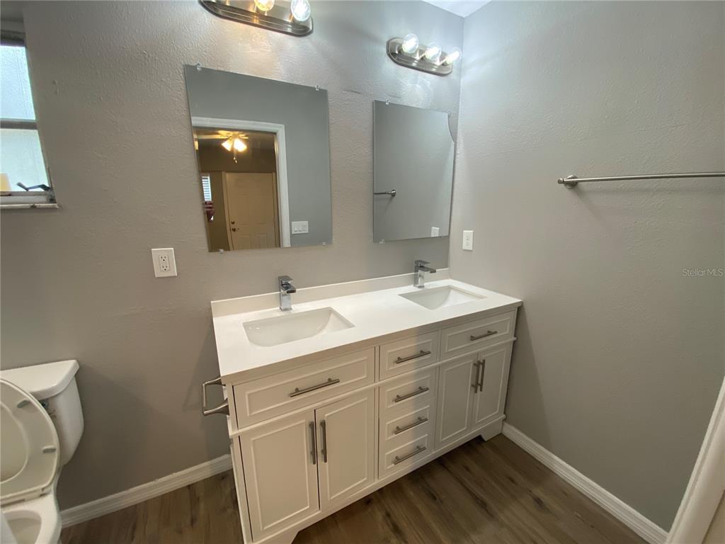 1908 West St Louis Street Tampa, FL 33607 - Photo 12 of 28 a bathroom with a double vanity sink and a mirror