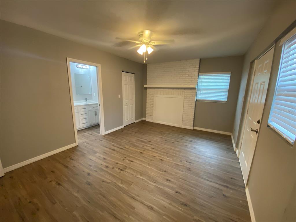1908 West St Louis Street Tampa, FL 33607 - Photo 14 of 28 wooden floor in an empty room with a window