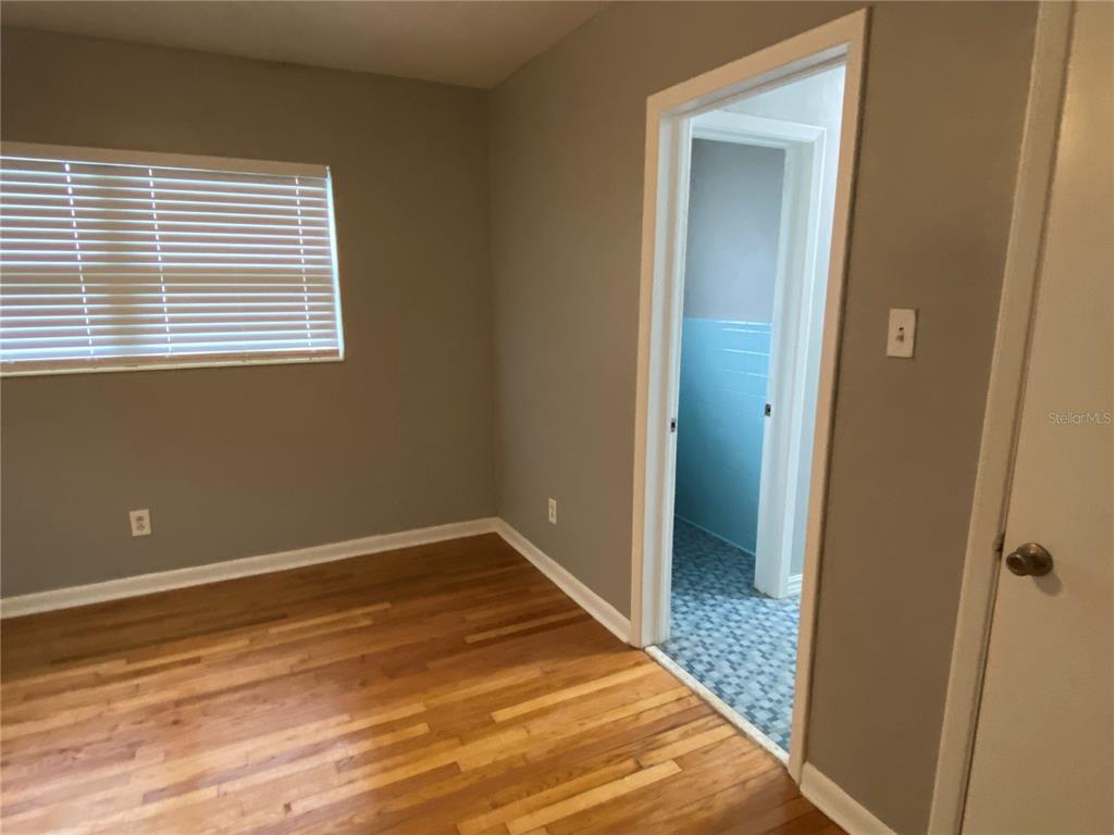 1908 West St Louis Street Tampa, FL 33607 - Photo 16 of 28 a view of a room with a wooden floor and a window